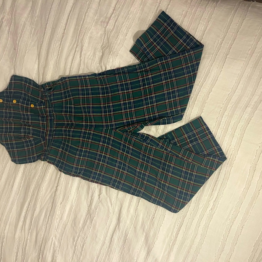This is a jumpsuit with buttons in the front and a zipper in the back!